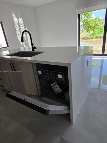 a close view of a sink and a stove in a room