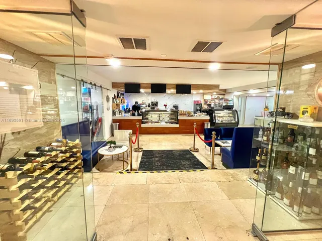 a living room with lots of furniture and a chandelier