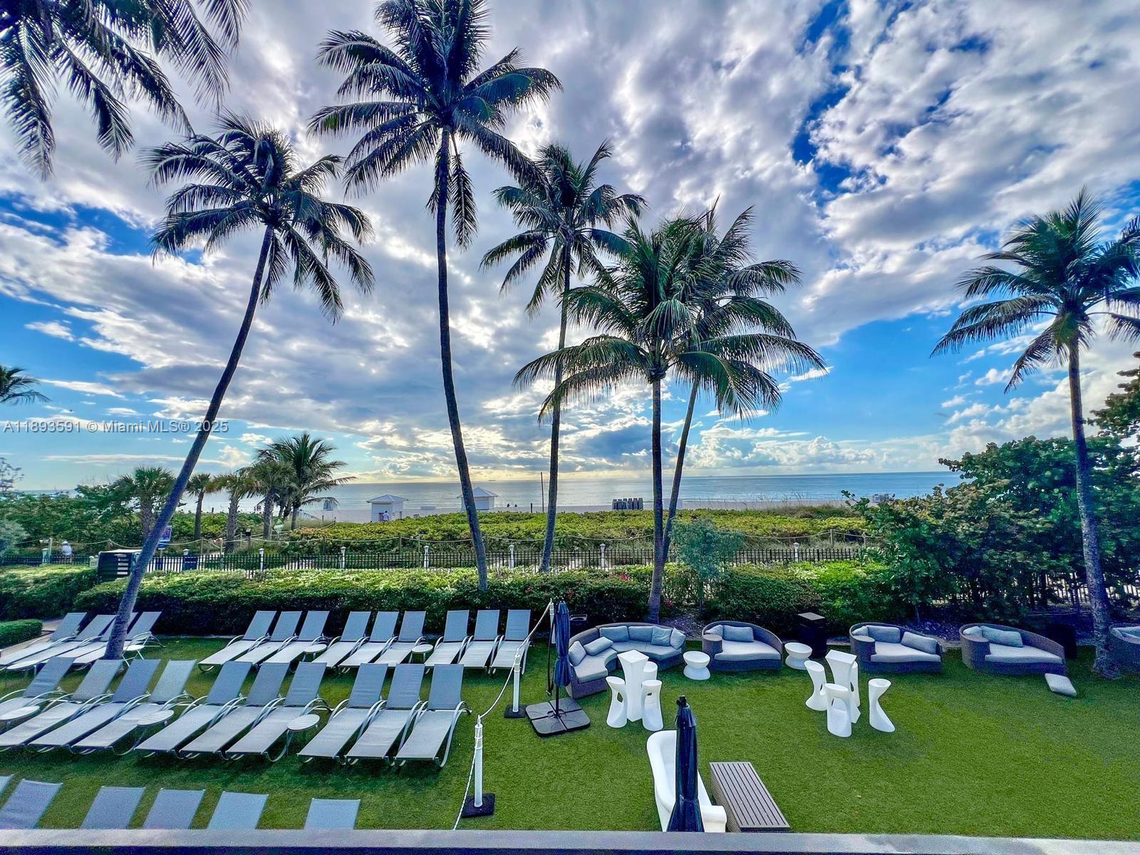 5225 Collins Avenue, Unit 517 Miami Beach, FL 33140 - Photo 13 of 20 a view of swimming pool yard and outdoor seating