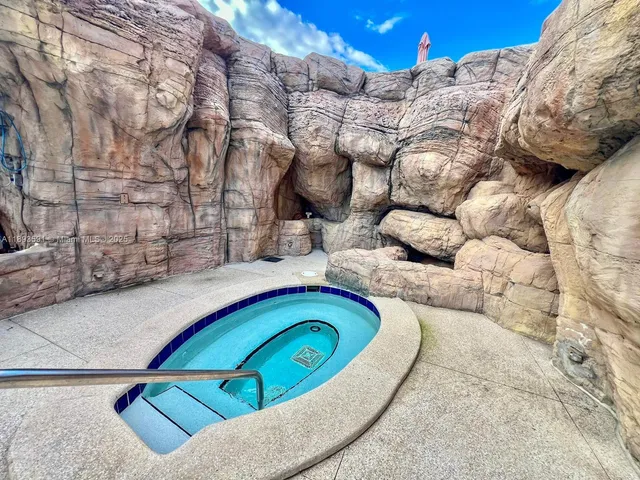 a view of swimming pool with outdoor seating