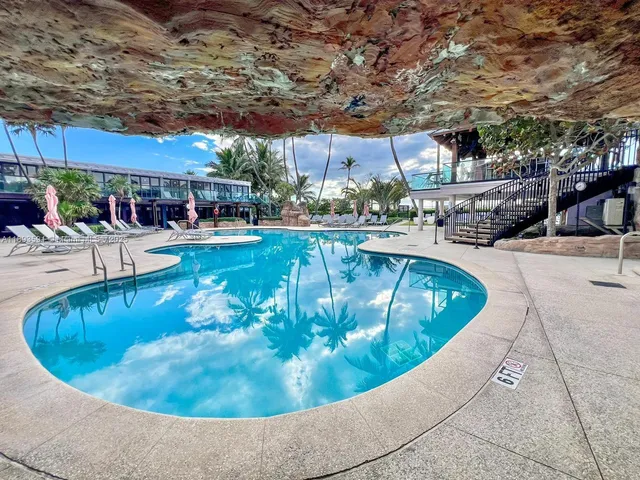 a view of a swimming pool with a patio