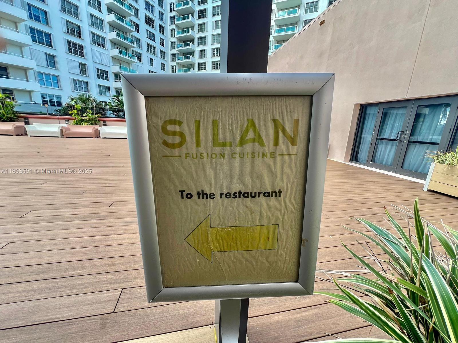 5225 Collins Avenue, Unit 517 Miami Beach, FL 33140 - Photo 19 of 20 a sign on the side of a building