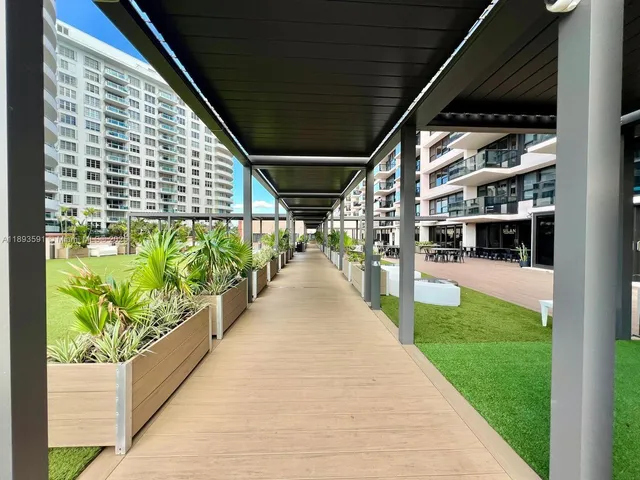 a view of swimming pool with outdoor seating