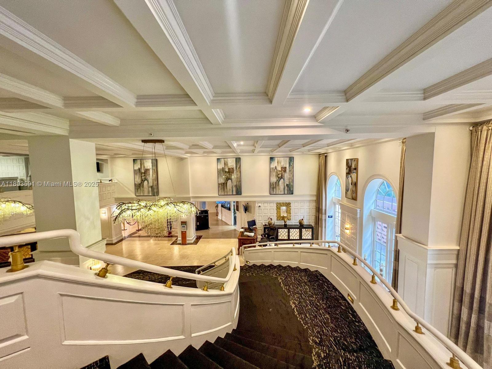 5225 Collins Avenue, Unit 517 Miami Beach, FL 33140 - Photo 9 of 20 a living room with furniture and a large window