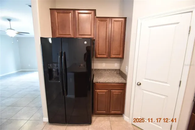 a kitchen with a sink a counter space and cabinets