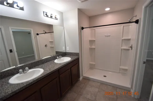 a bathroom with a shower and toilet
