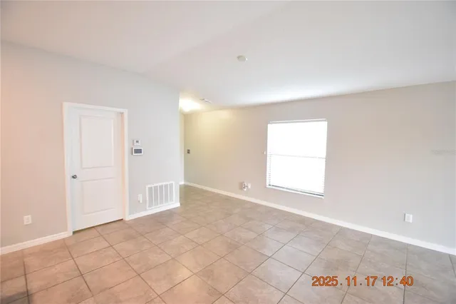 a large kitchen with a large counter top stainless steel appliances and cabinets