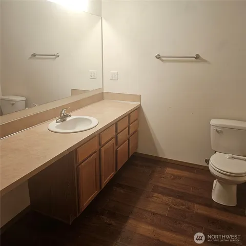 a view of wooden floor in a bathroom