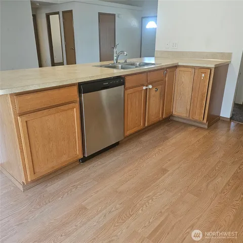 a bathroom with a double vanity sink and mirror