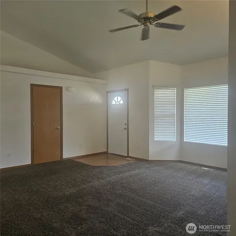 a view of an empty room with a window