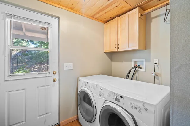 a view of storage and utility room with washer and dryer