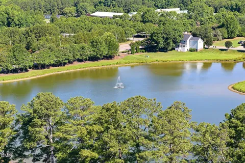 a view of a lake with a yard