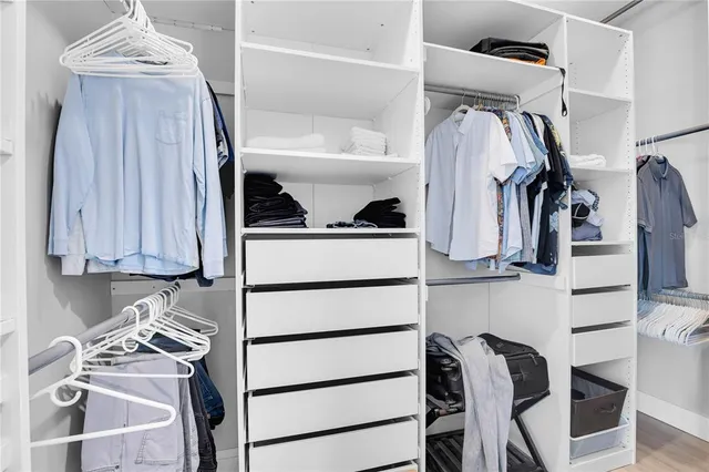 an aerial view of residential house with outdoor space and trees all around