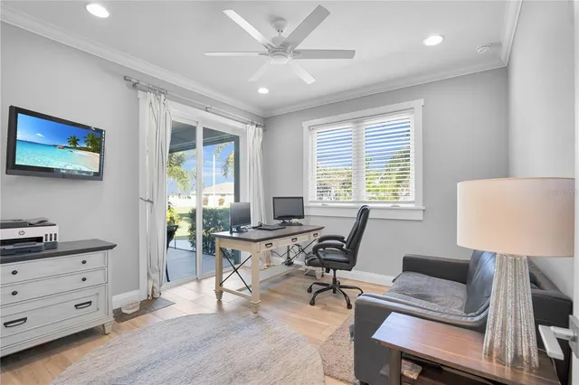a view of house with backyard and sitting area