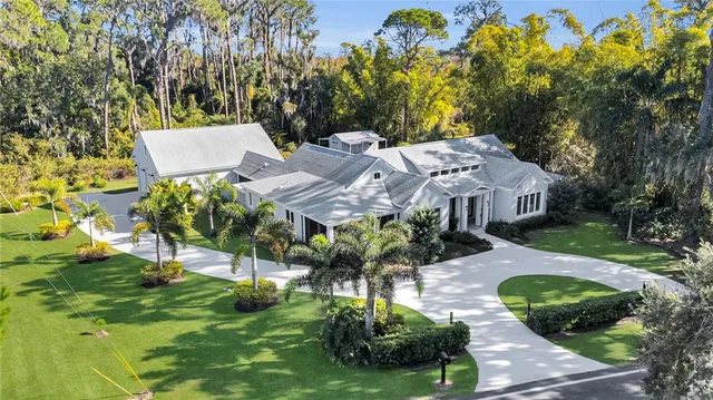 a view of a patio with table and chairs