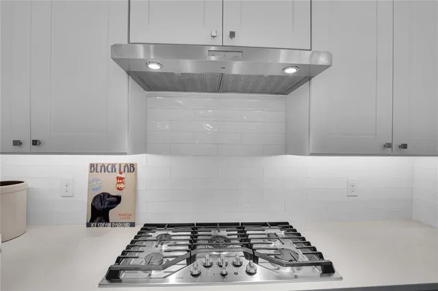 a view of a livingroom with a table and workspace