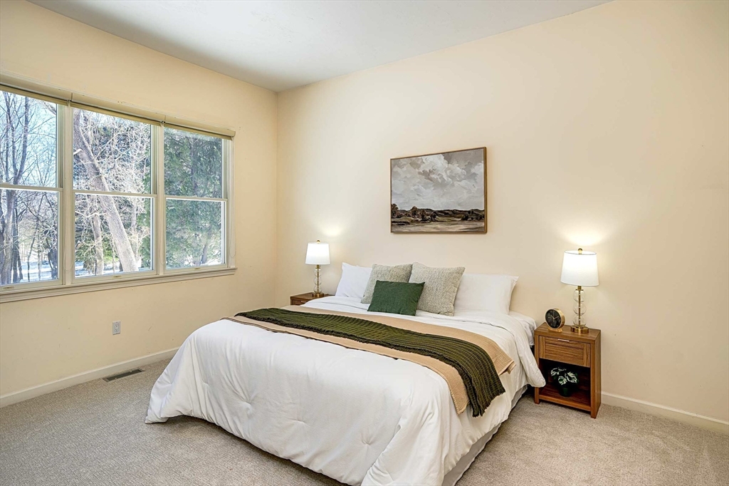 173 Nobscot Road, Unit 173 Sudbury, MA 01776 - Photo 14 of 37 a bedroom with a bed and a window