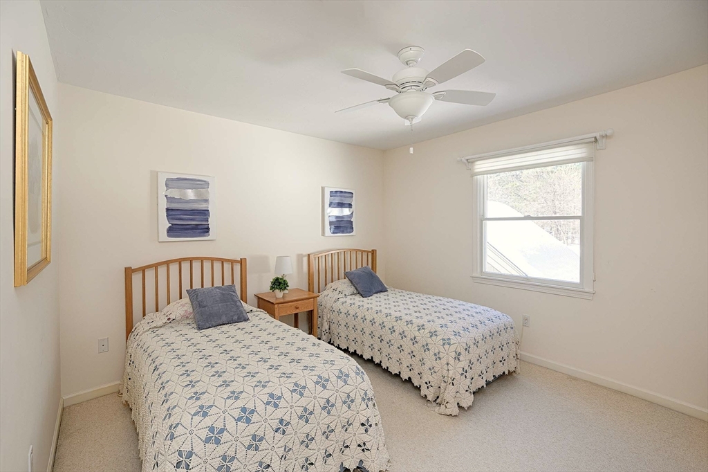 173 Nobscot Road, Unit 173 Sudbury, MA 01776 - Photo 23 of 37 a bedroom with two beds and a window