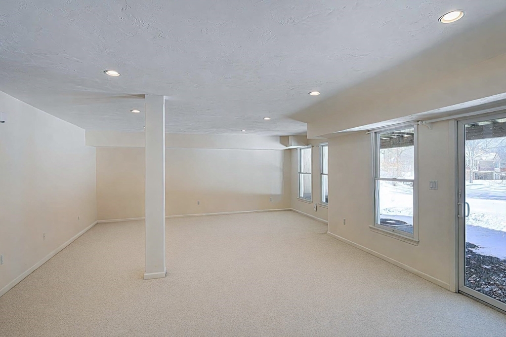 173 Nobscot Road, Unit 173 Sudbury, MA 01776 - Photo 26 of 37 a view of empty room with windows