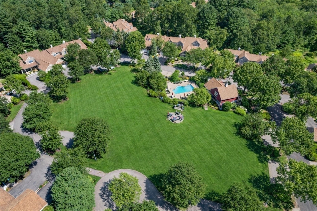 173 Nobscot Road, Unit 173 Sudbury, MA 01776 - Photo 33 of 37 an aerial view of residential house with outdoor space and trees all around