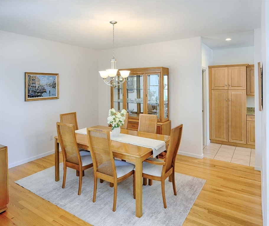 173 Nobscot Road, Unit 173 Sudbury, MA 01776 - Photo 4 of 37 a view of a dining room with furniture window and wooden floor