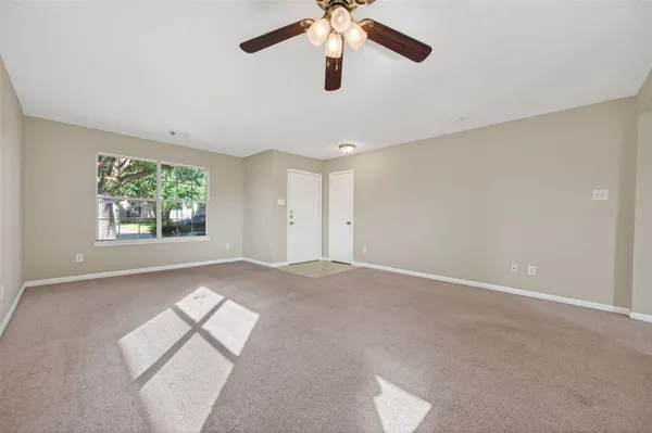 a view of empty room with windows