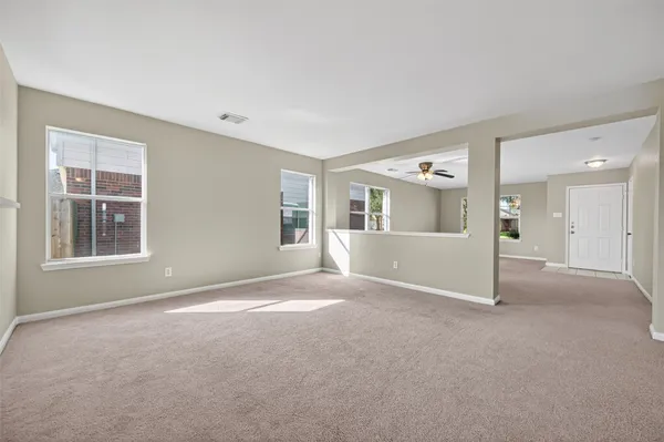 a view of a big room with a kitchen