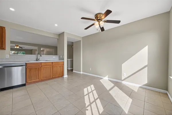 a kitchen with stainless steel appliances a refrigerator and microwave