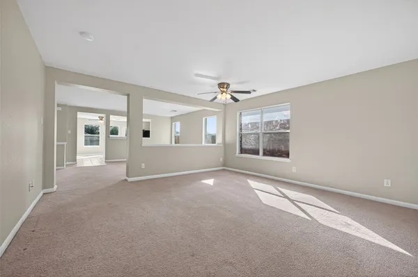 a view of an empty room with a window