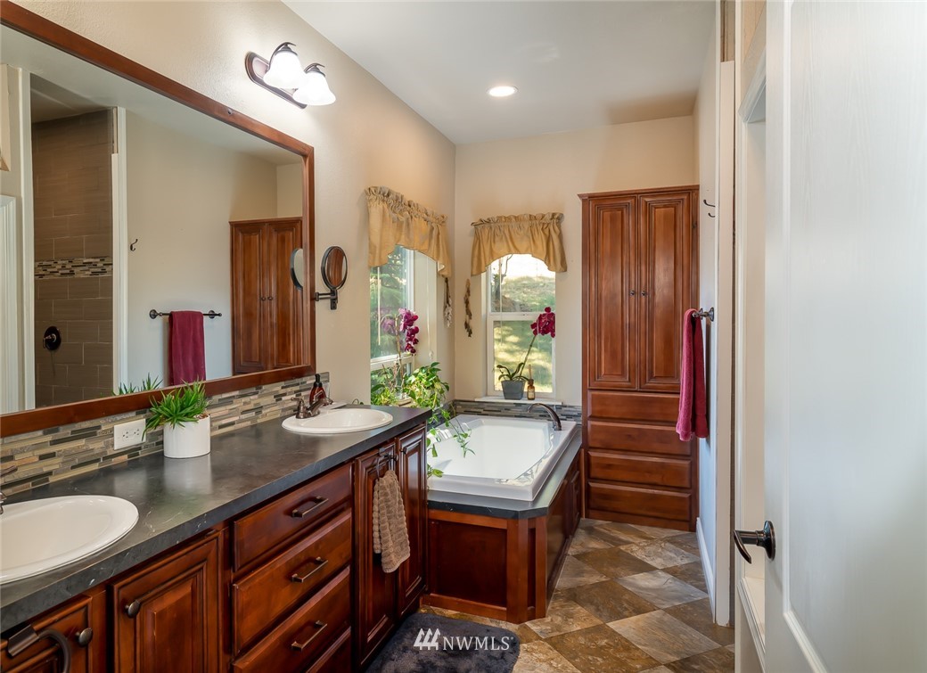 3111 Bettas Road Cle Elum, WA 98922 - Photo 16 of 21 a bathroom with a double vanity sink and a mirror