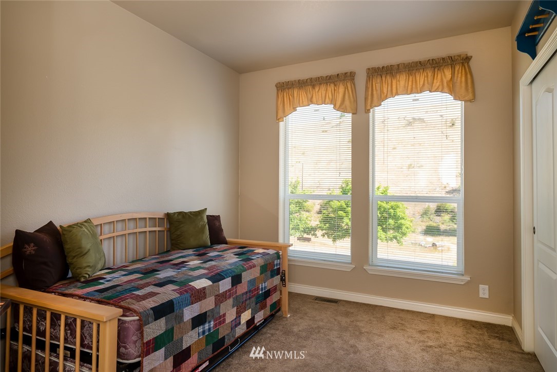 3111 Bettas Road Cle Elum, WA 98922 - Photo 20 of 21 a bedroom with a bed and wooden floor