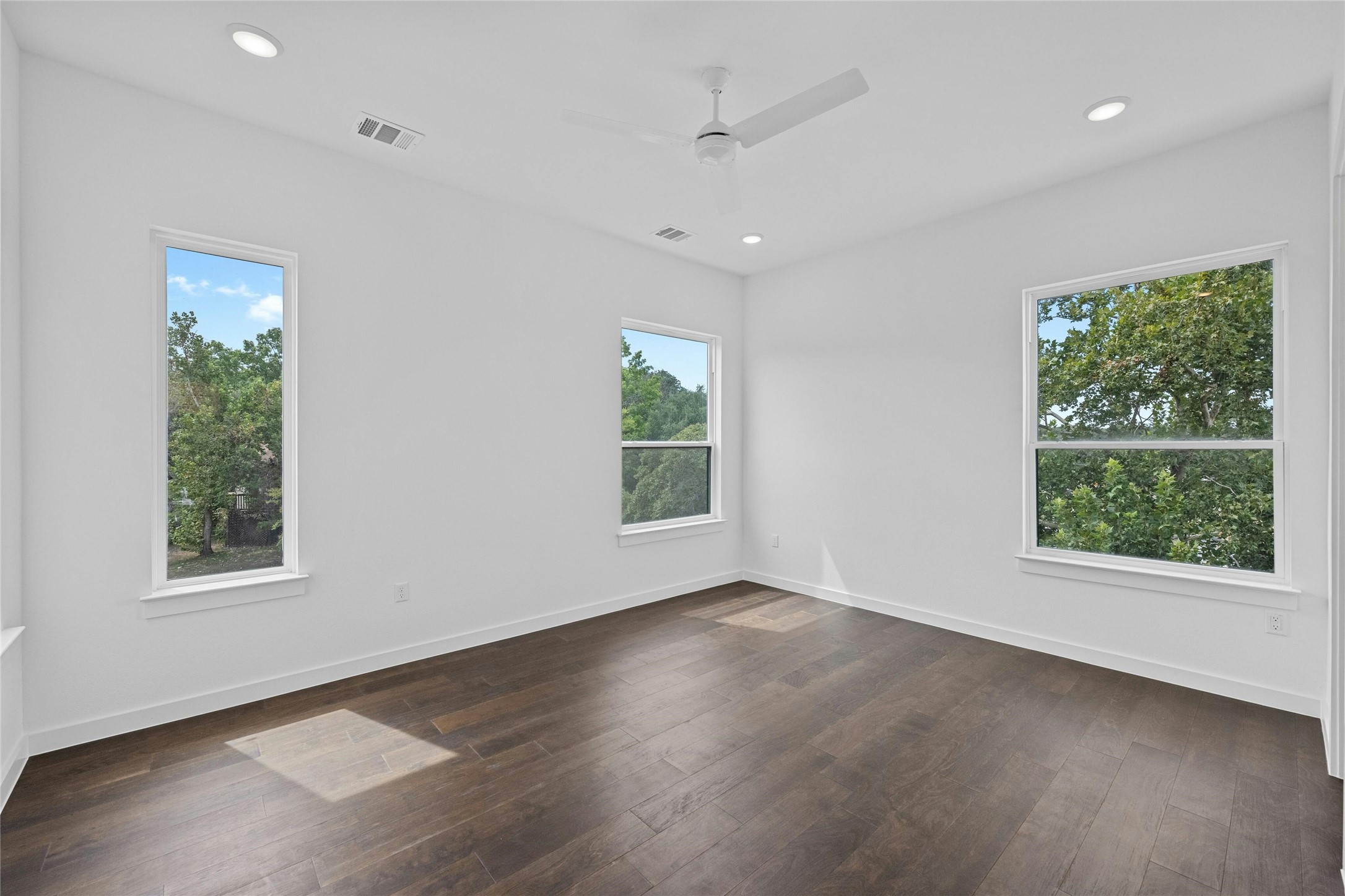 6825 Wolfcreek Pass, Unit 2 Austin, TX 78749 - Photo 13 of 34 a view of an empty room with wooden floor and a window