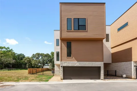 a front view of a house with garage