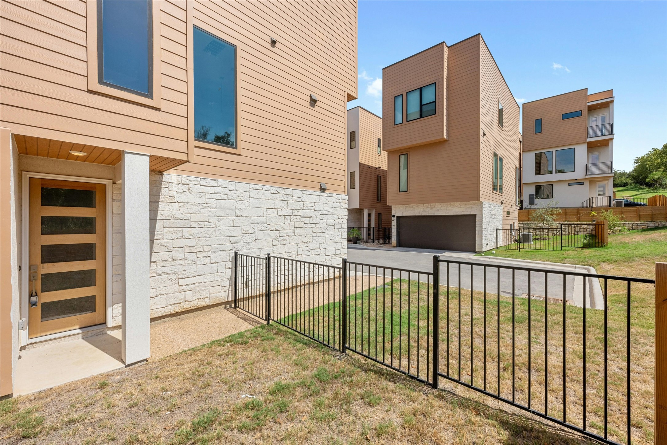 6825 Wolfcreek Pass, Unit 2 Austin, TX 78749 - Photo 28 of 34 a view of a brick house with a small yard