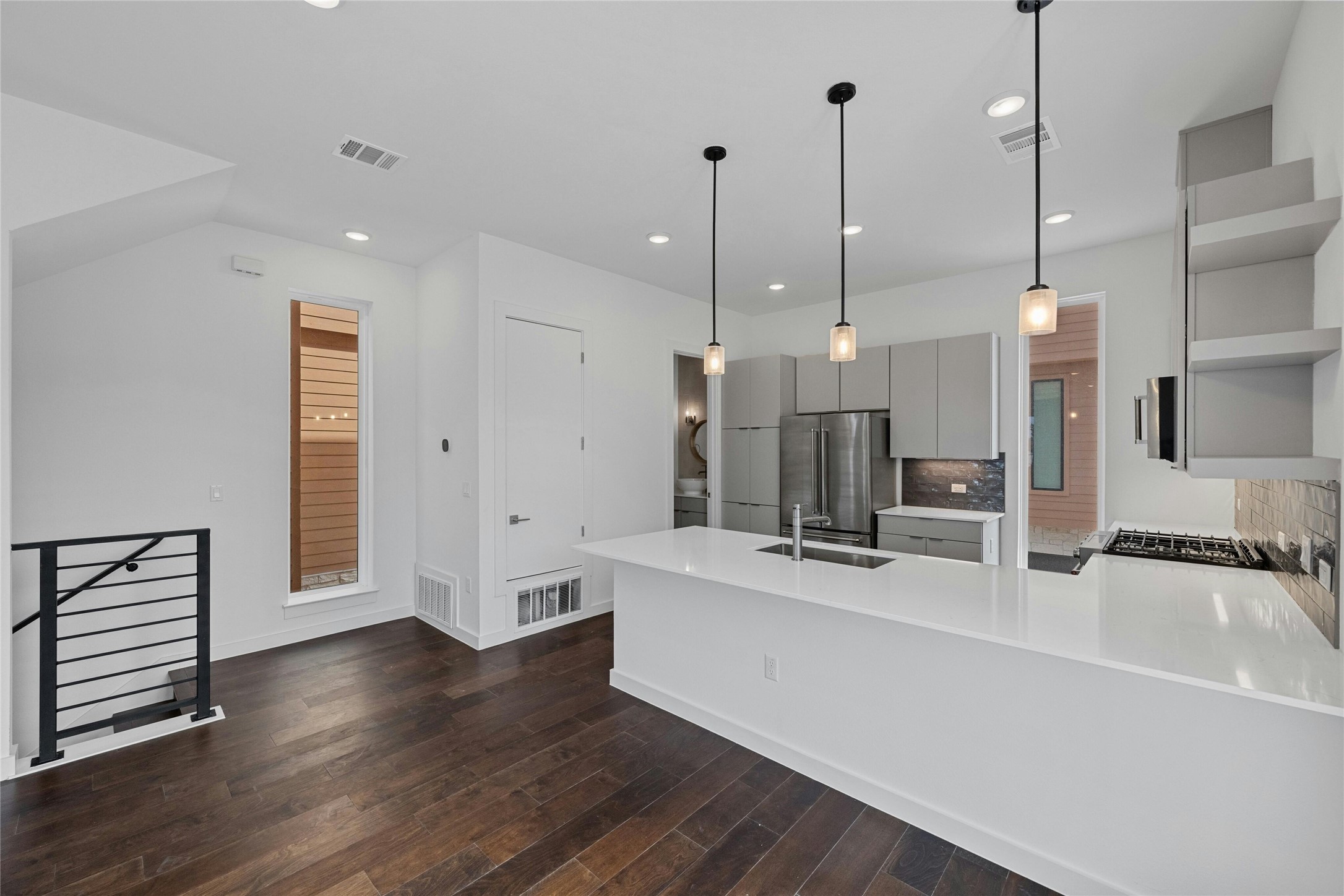 6825 Wolfcreek Pass, Unit 2 Austin, TX 78749 - Photo 7 of 34 a large white kitchen with a large island
