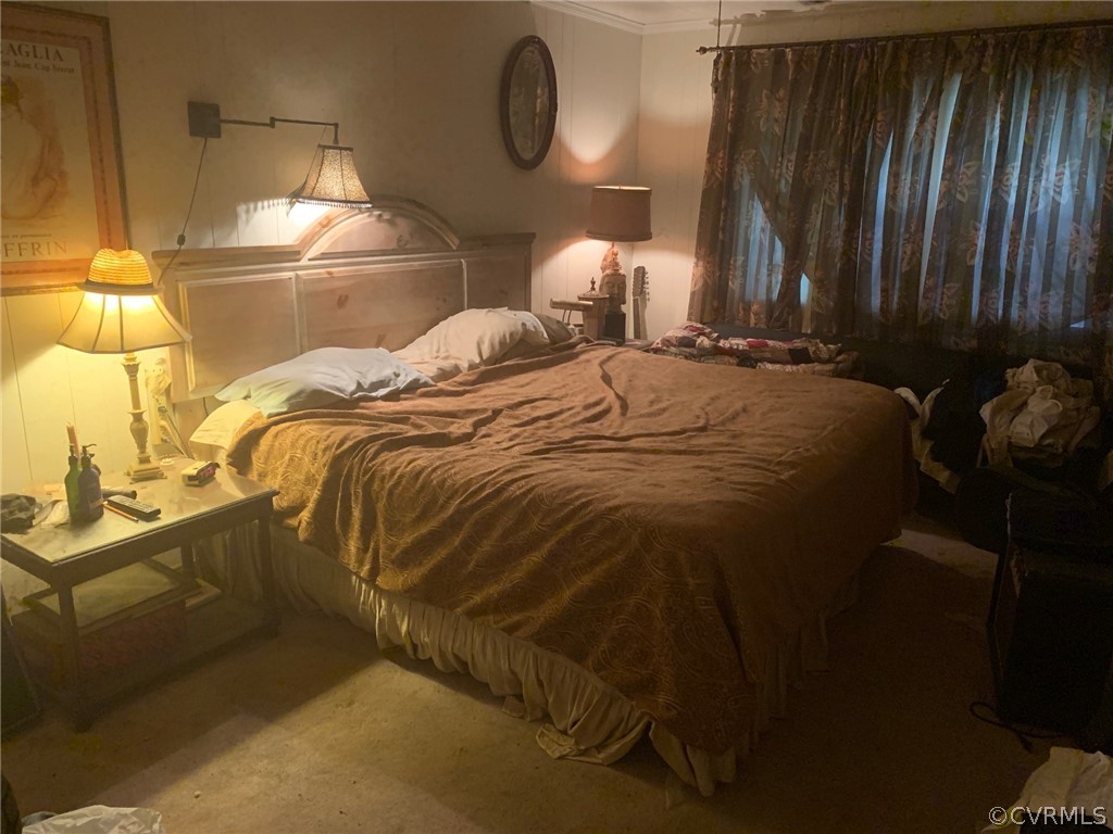 1832 Manakin Road Manakin-Sabot, VA 23103 - Photo 16 of 23 a bed sitting in a bedroom next to a lamp