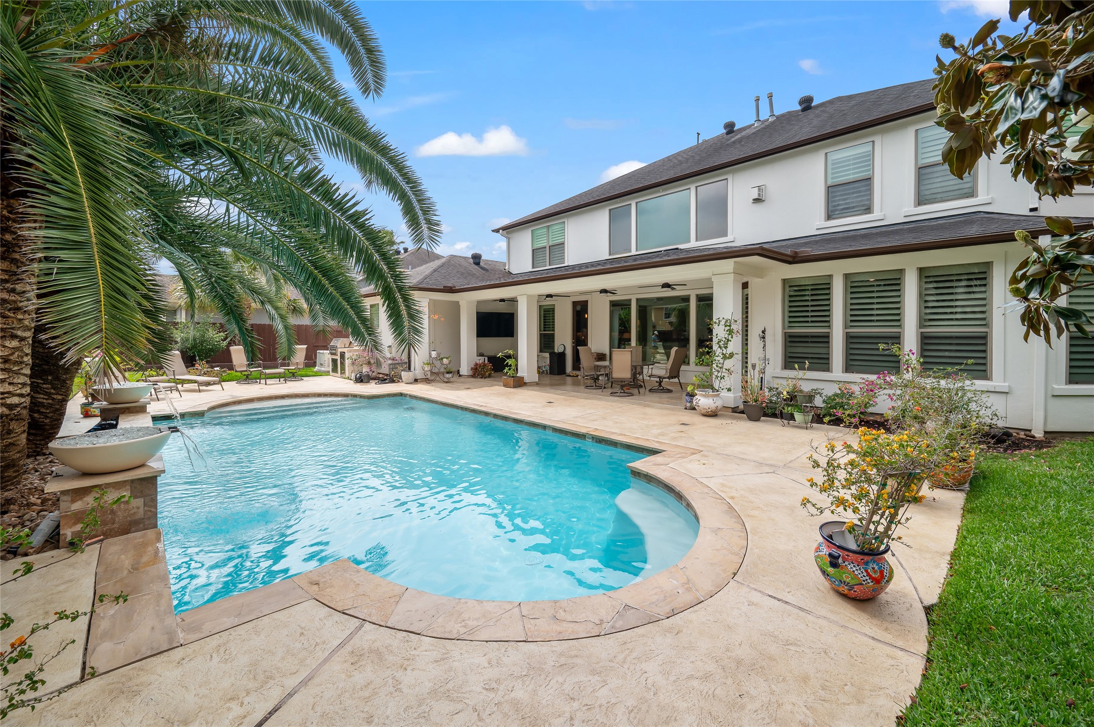 2127 Thicket Ridge Lane Houston, TX 77077 - Photo 42 of 48 Imagine relaxing with your family and friends in this beautiful resort type backyard with a heated pool.