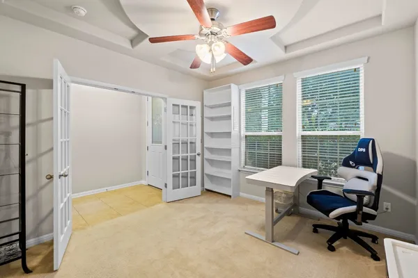 a view of a livingroom with furniture and a window