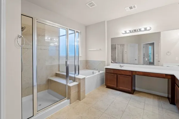 a bed room with a bed and a chandelier