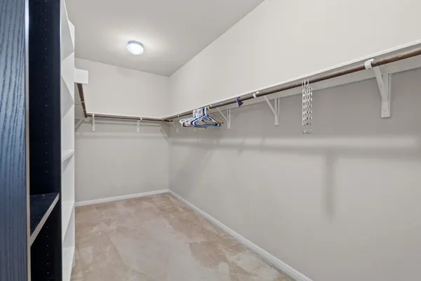 a white bath tub sitting next to a shower