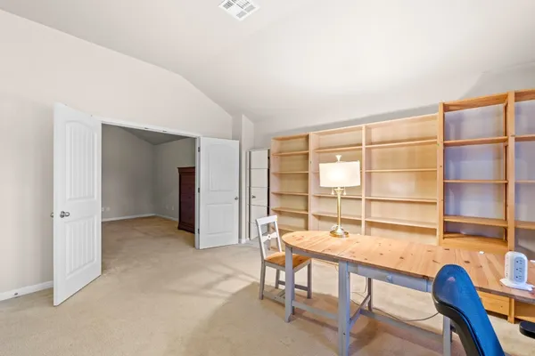 a view of a livingroom with furniture and a window
