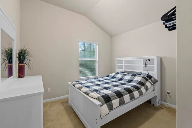 a view of a living room with furniture and a window