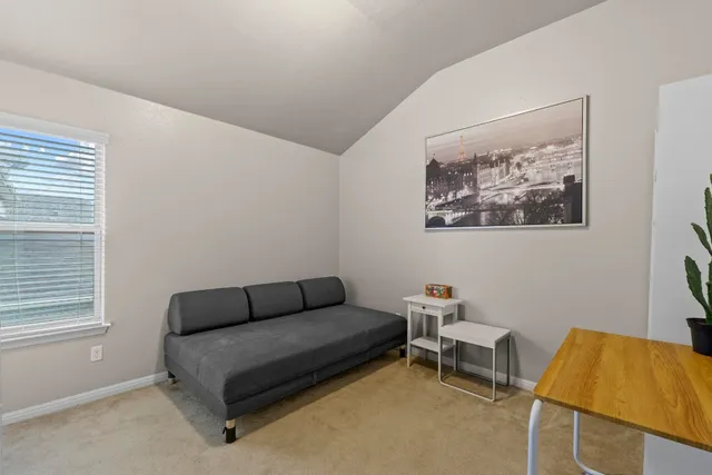 a bathroom with a granite countertop sink a toilet and mirror