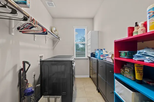 a bathroom with a sink mirror and toilet