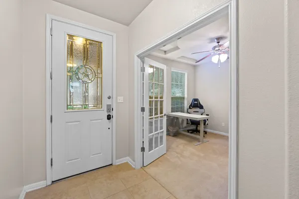 a dining hall with stainless steel appliances granite countertop a dining table chair with granite countertops and couches