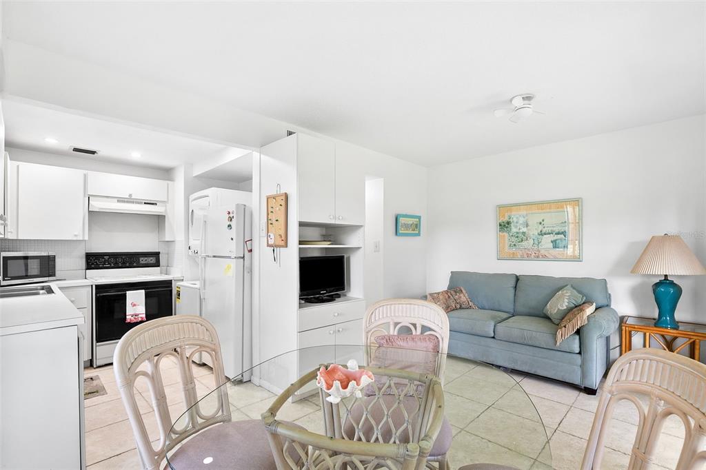 597 Sutton Place Longboat Key, FL 34228 - Photo 15 of 49 a living room with furniture and kitchen view