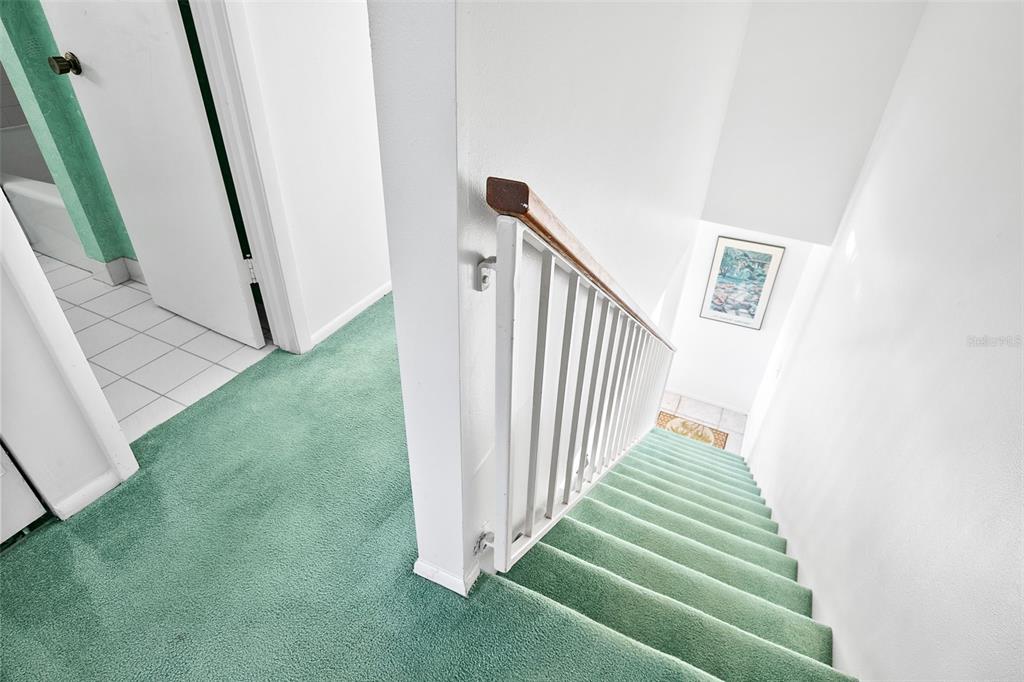 597 Sutton Place Longboat Key, FL 34228 - Photo 16 of 49 a view of a staircase in back of a house