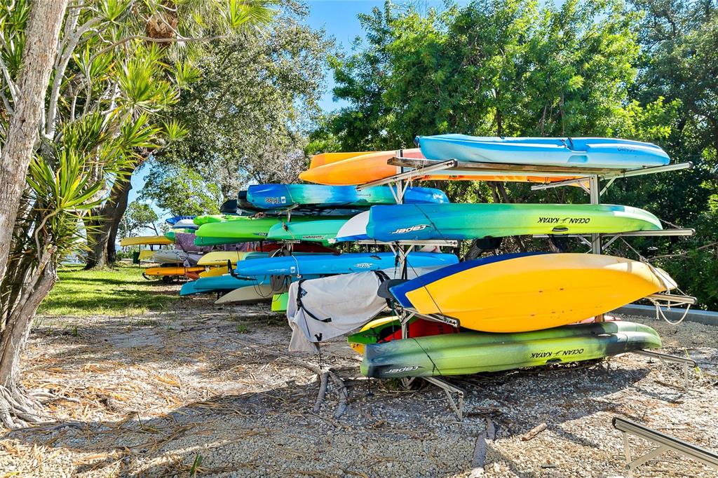 597 Sutton Place Longboat Key, FL 34228 - Photo 23 of 49 a view of a swimming pool with a lounge chairs