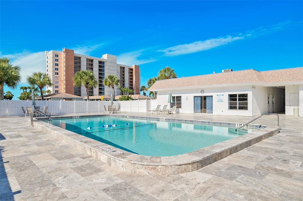 597 Sutton Place Longboat Key, FL 34228 - Photo 31 of 49 a view of a house with a swimming pool