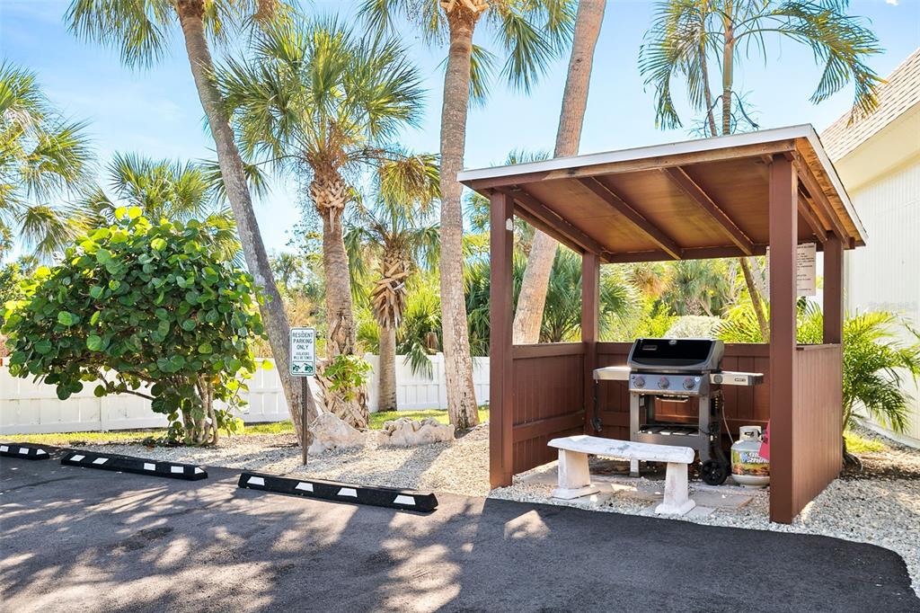 597 Sutton Place Longboat Key, FL 34228 - Photo 32 of 49 a view of backyard with a patio
